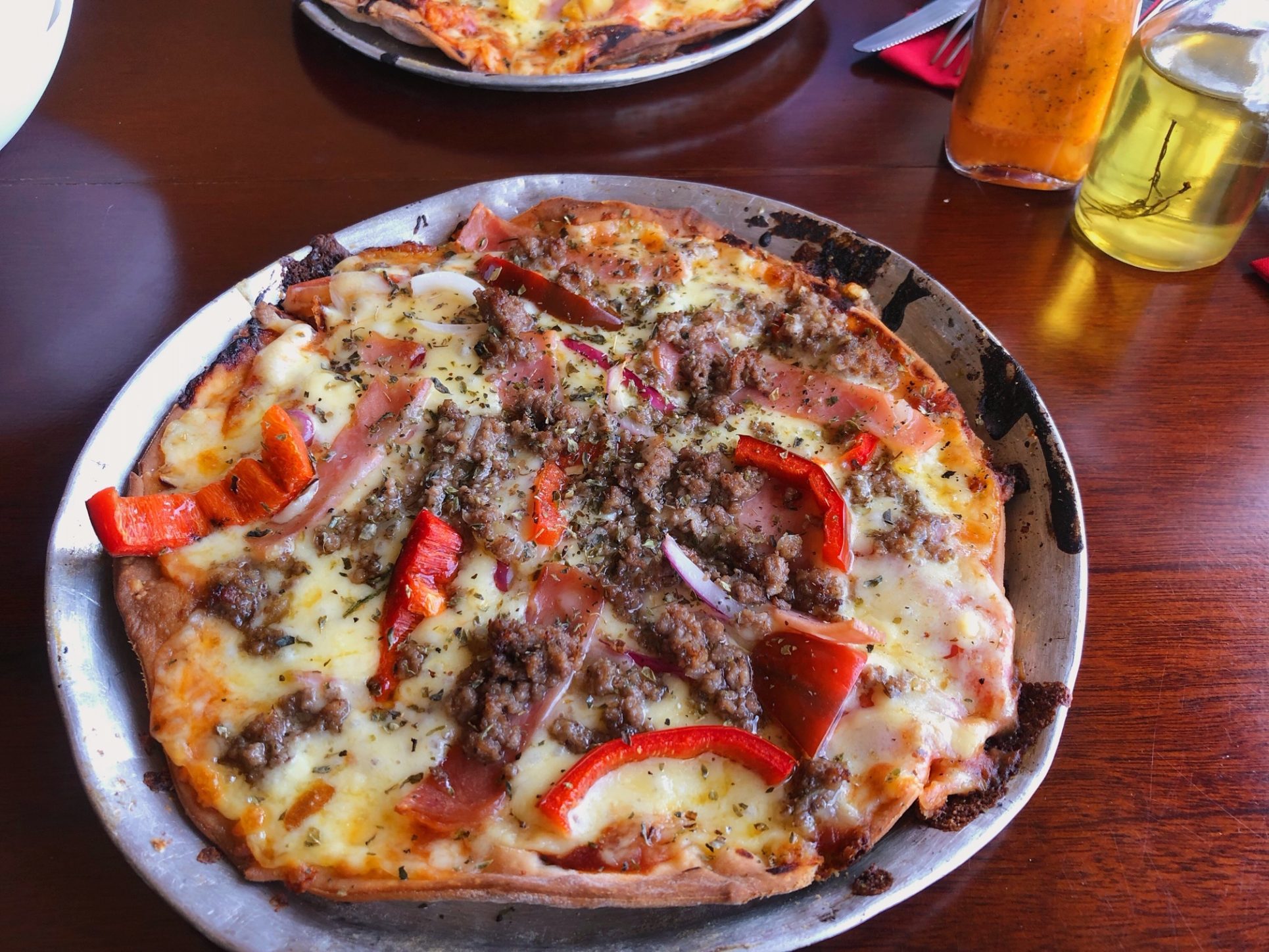 El Portón Rojo: tres locaciones, el mismo sabor de una pizza premiada